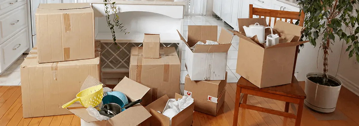 Packed moving boxes and household items in a kitchen before move-out or move-in cleaning, Indianapolis, IN.